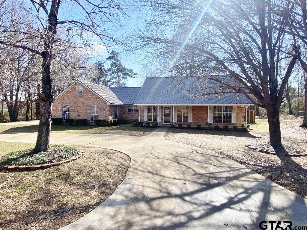 1707 Rotan Road Mount Pleasant, TX 75455 - Photo 1 of 18 a front view of a house with a yard covered in snow