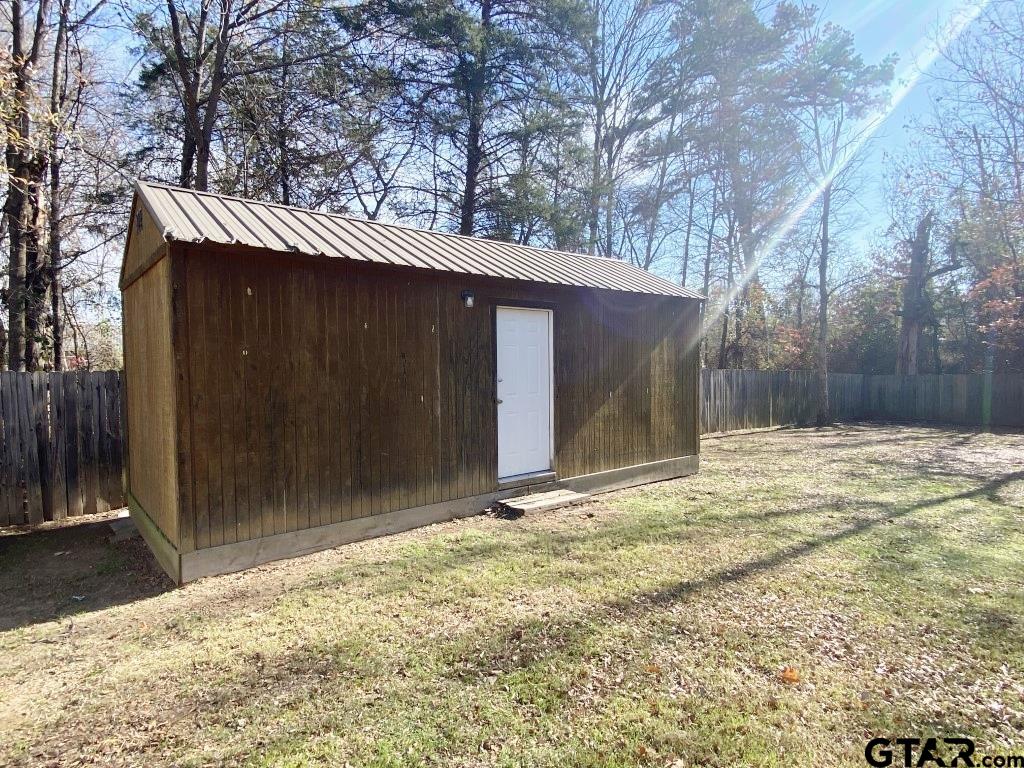 1707 Rotan Road Mount Pleasant, TX 75455 - Photo 17 of 18 a backyard of a house