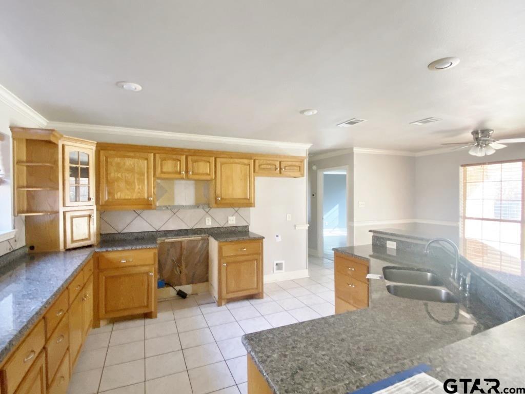 1707 Rotan Road Mount Pleasant, TX 75455 - Photo 4 of 18 a large white kitchen with a large window