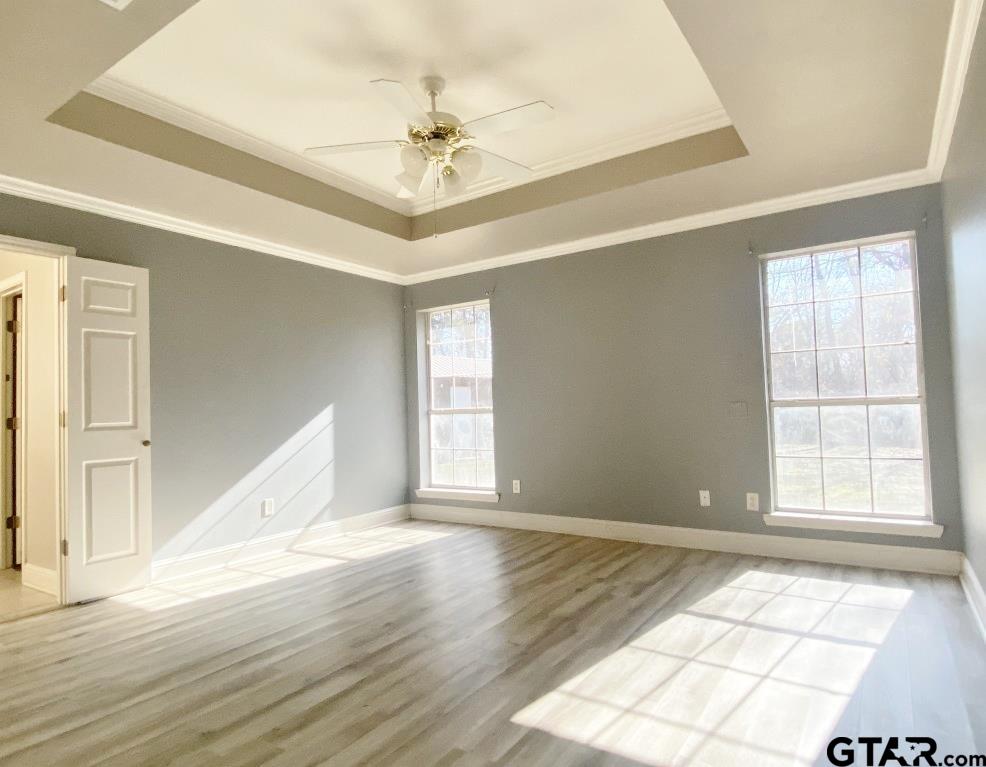 1707 Rotan Road Mount Pleasant, TX 75455 - Photo 8 of 18 a view of an empty room with wooden floor and window