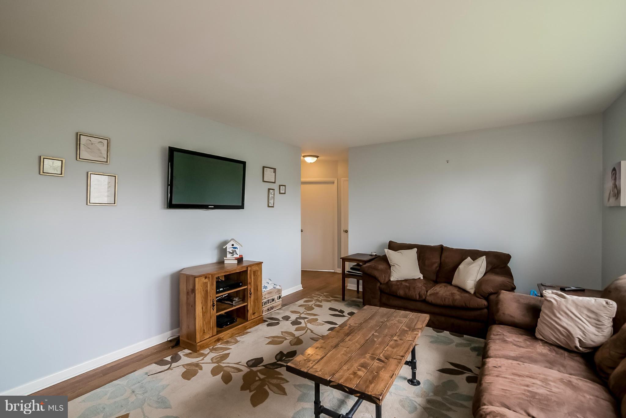 8019 Old Receiver Road Frederick, MD 21702 - Photo 2 of 25 a living room with furniture and a flat screen tv