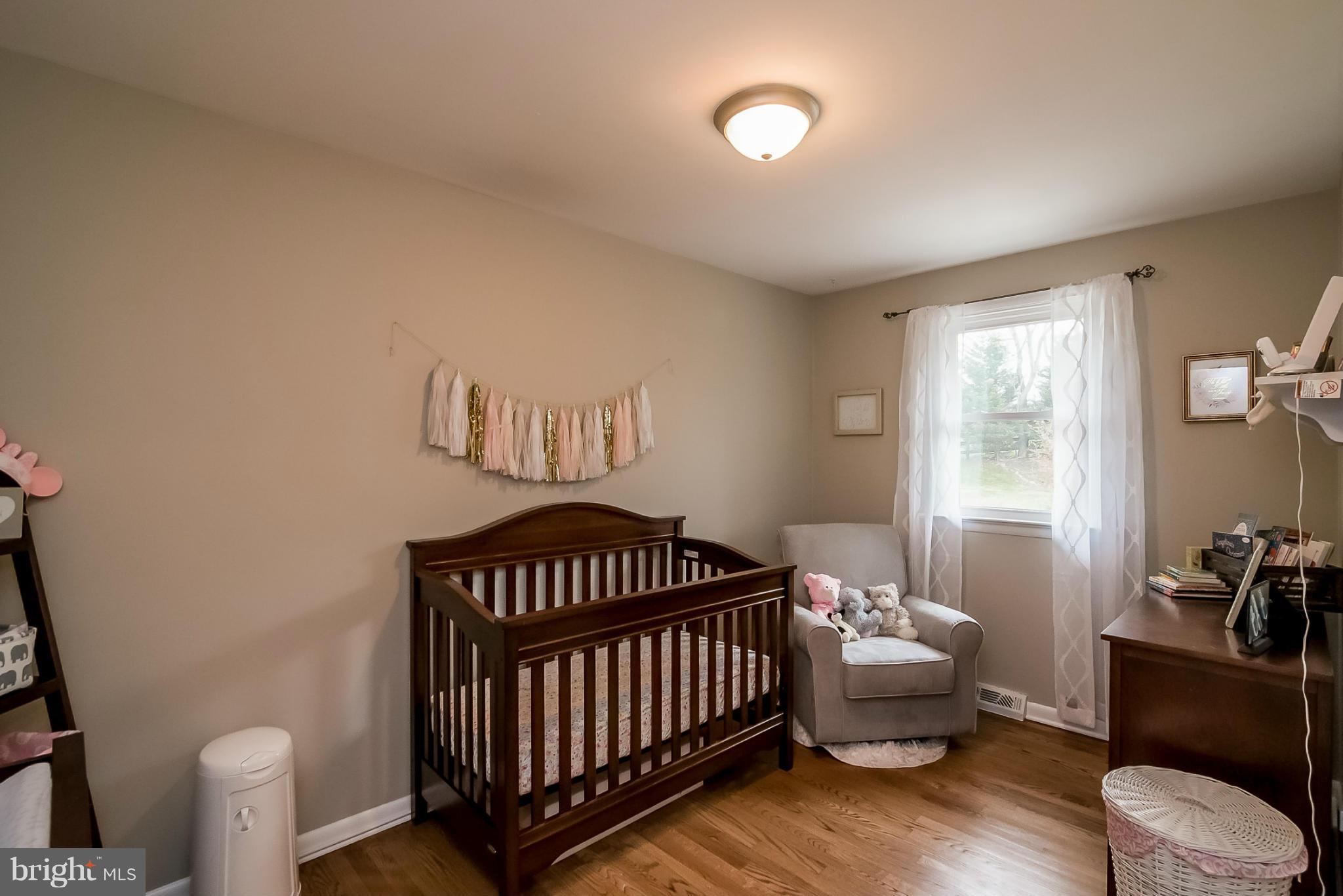 8019 Old Receiver Road Frederick, MD 21702 - Photo 11 of 25 a bedroom with a bed and wooden floor