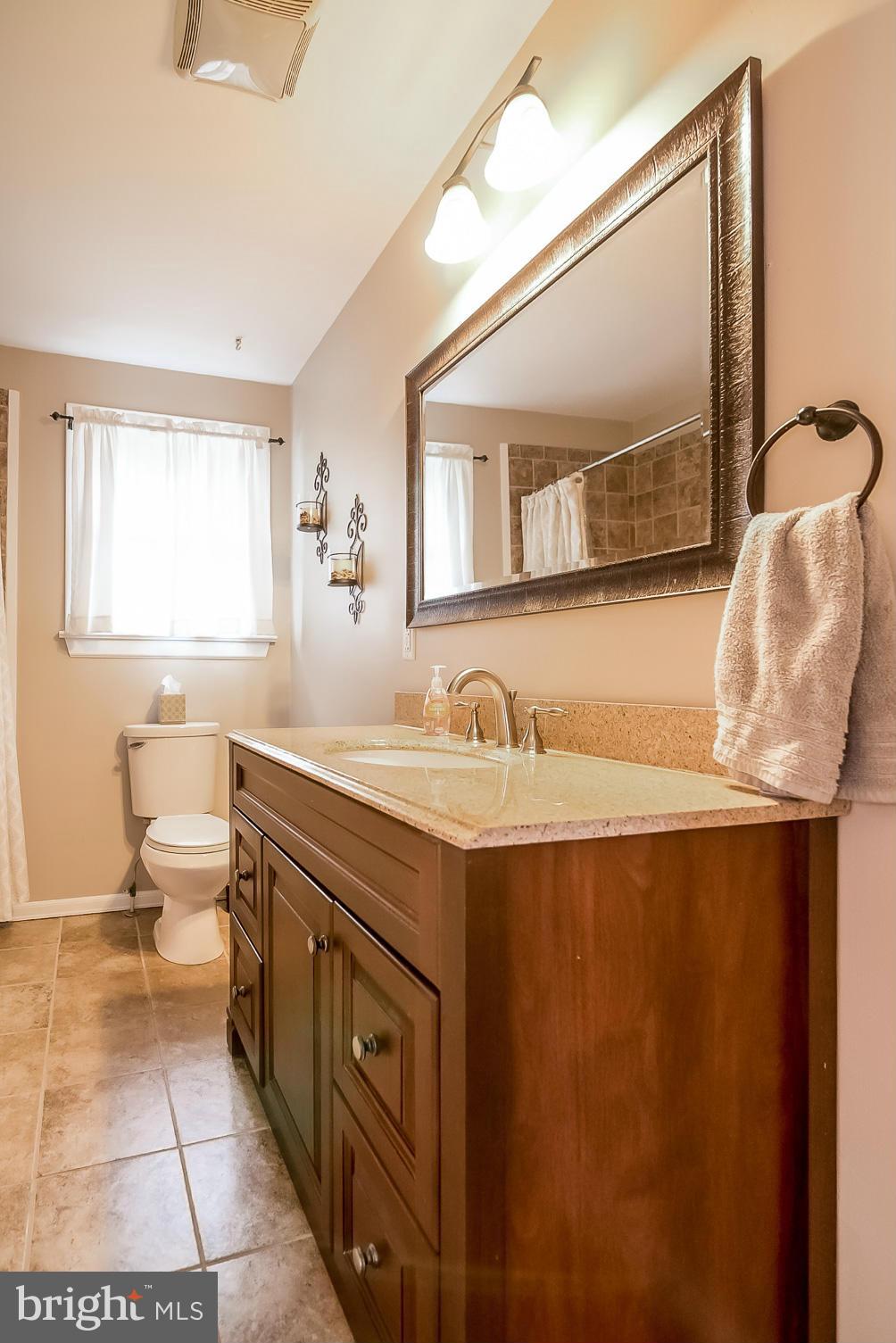 8019 Old Receiver Road Frederick, MD 21702 - Photo 12 of 25 a bathroom with a sink and a mirror