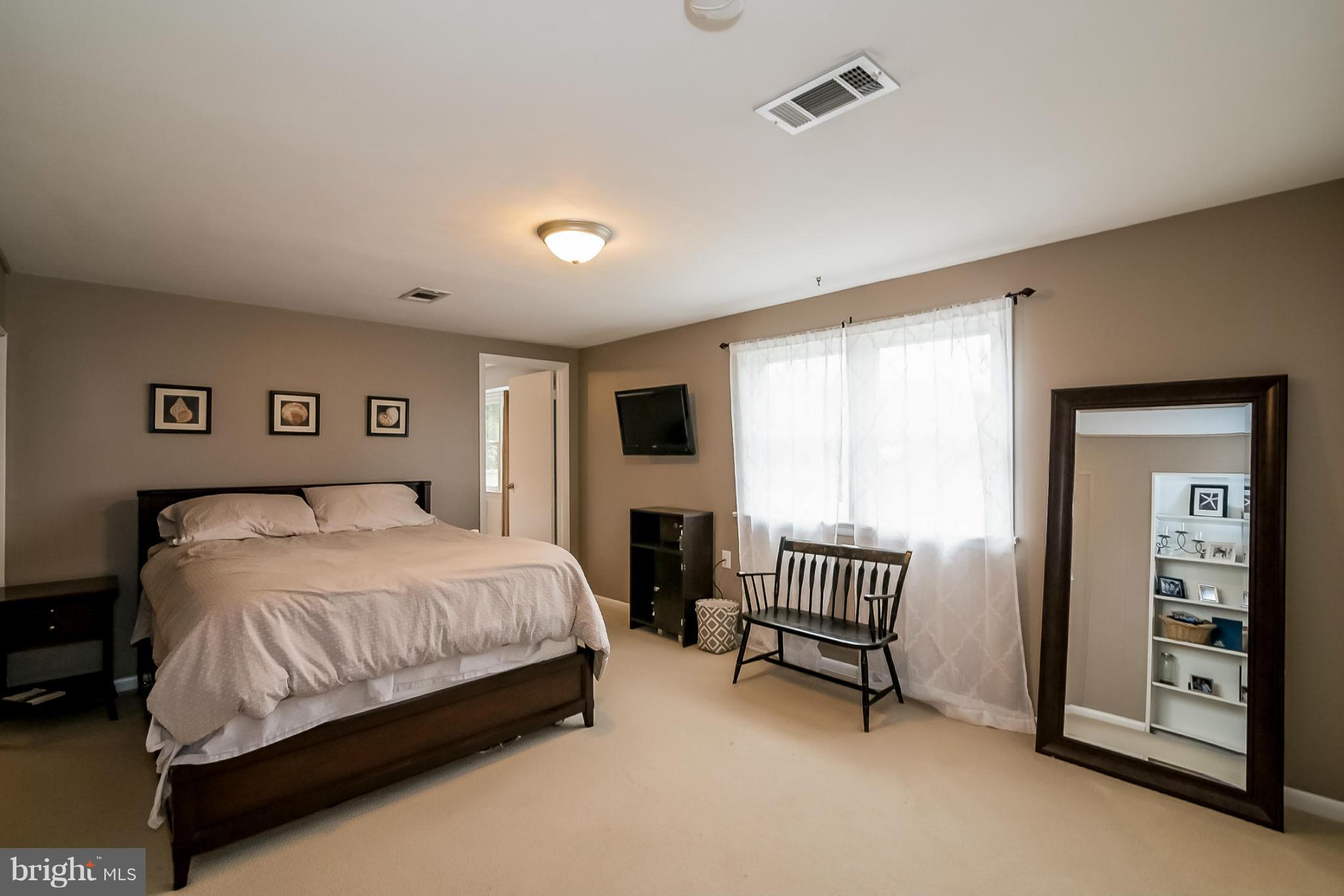 8019 Old Receiver Road Frederick, MD 21702 - Photo 16 of 25 a bedroom with a bed and a chair