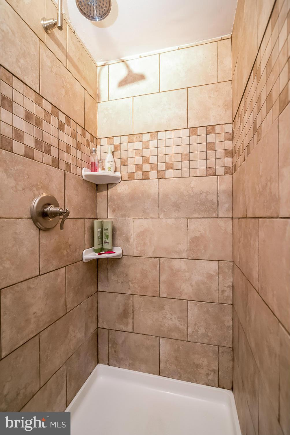 8019 Old Receiver Road Frederick, MD 21702 - Photo 18 of 25 a bathroom with a shower