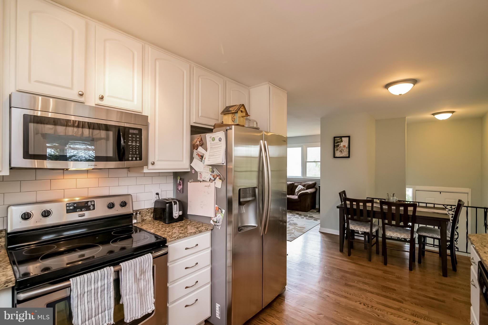 8019 Old Receiver Road Frederick, MD 21702 - Photo 6 of 25 a kitchen with stainless steel appliances a stove a sink and a refrigerator