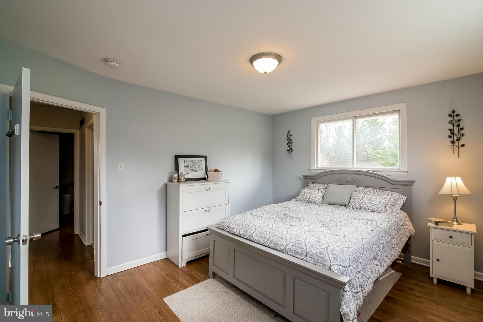 8019 Old Receiver Road Frederick, MD 21702 - Photo 8 of 25 a bedroom with a bed and wooden floor