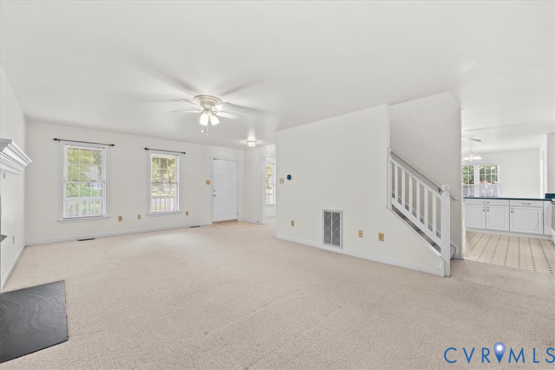 2924 Warfield Ridge Terrace Chester, VA 23831 - Photo 11 of 38 Spacious living area featuring light-toned carpeti