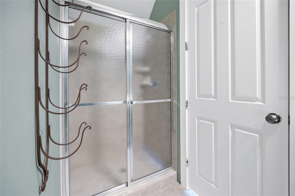 25 Southeast 69th Place Ocala, FL 34480 - Photo 26 of 52 a bathroom that has a glass shower door