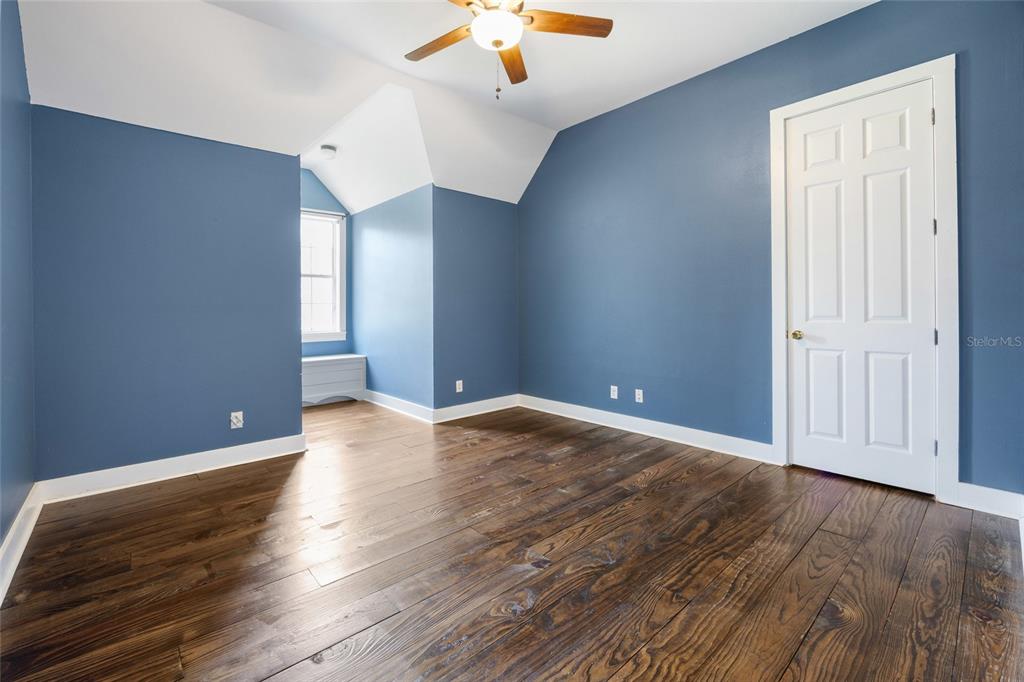 25 Southeast 69th Place Ocala, FL 34480 - Photo 27 of 52 wooden floor in an empty room with a window