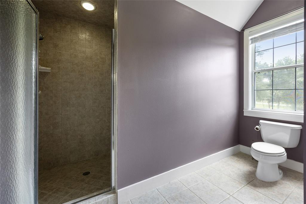 25 Southeast 69th Place Ocala, FL 34480 - Photo 29 of 52 a bathroom with a toilet and a shower