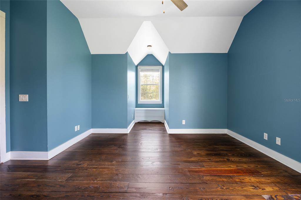 25 Southeast 69th Place Ocala, FL 34480 - Photo 33 of 52 a view of an empty room with wooden floor and window