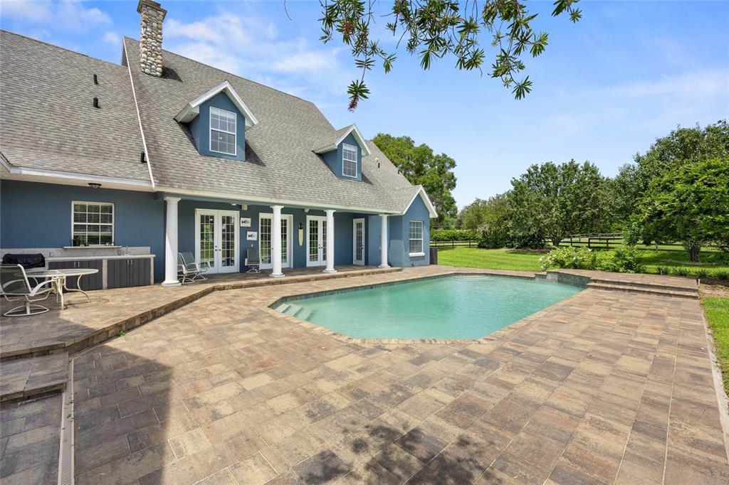 25 Southeast 69th Place Ocala, FL 34480 - Photo 36 of 52 a view of outdoor space yard swimming pool and porch