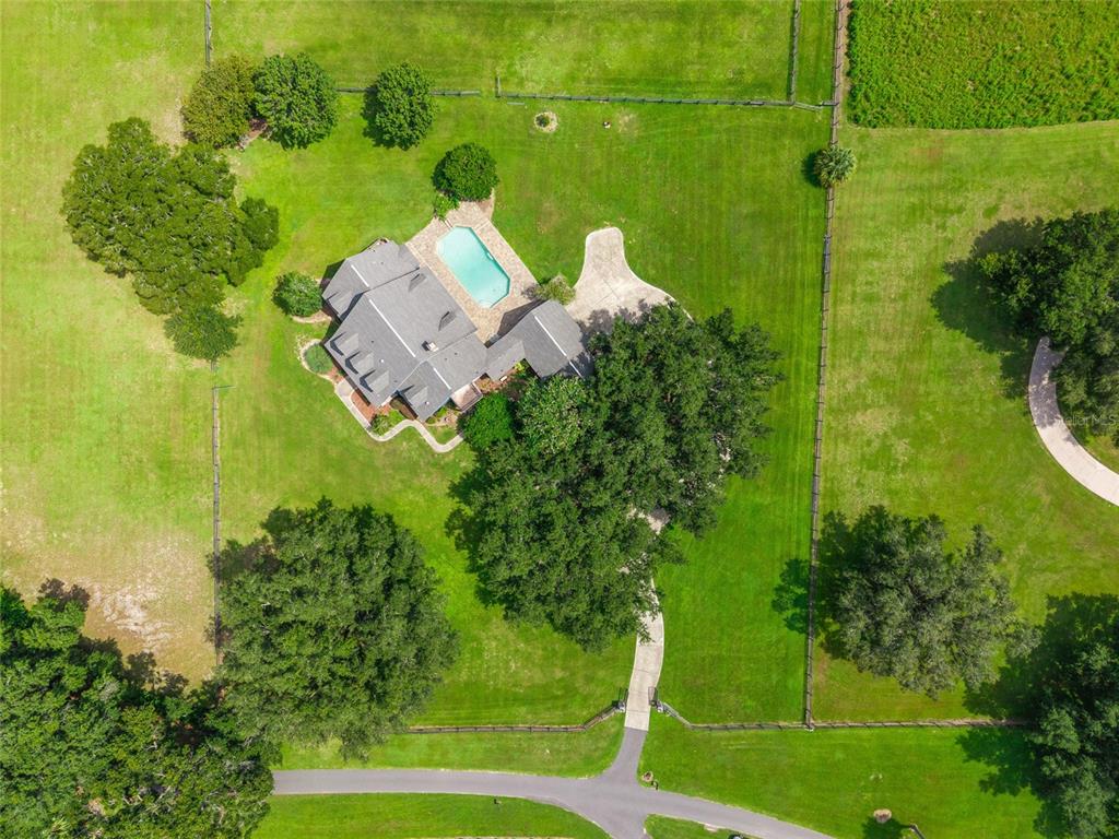 25 Southeast 69th Place Ocala, FL 34480 - Photo 37 of 52 an aerial view of a house with a yard basket ball court and outdoor seating