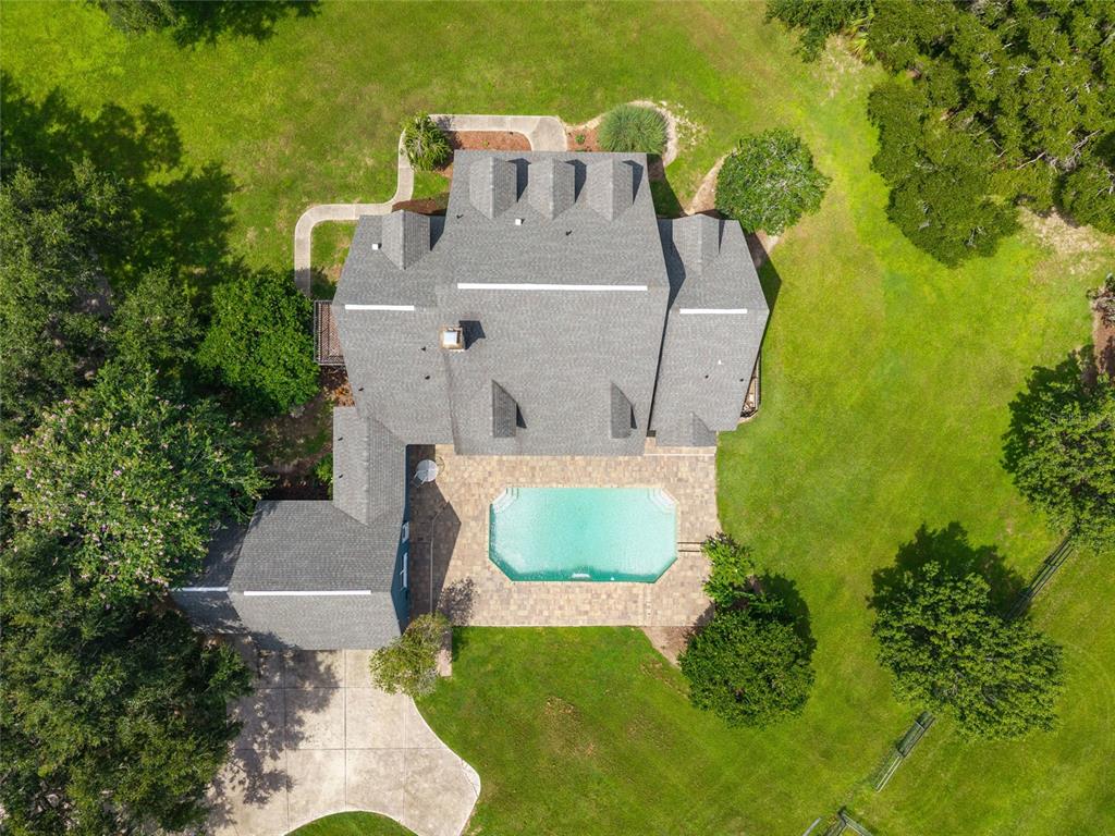 25 Southeast 69th Place Ocala, FL 34480 - Photo 38 of 52 an aerial view of a house with pool and garden