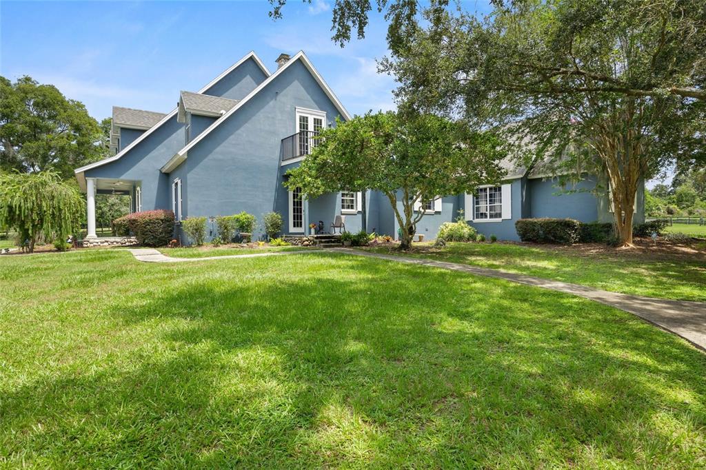 25 Southeast 69th Place Ocala, FL 34480 - Photo 45 of 52 a view of a house with a yard