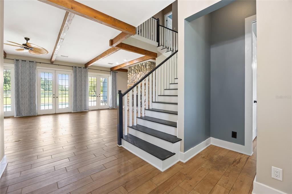 25 Southeast 69th Place Ocala, FL 34480 - Photo 6 of 52 a view of entryway and hall with wooden floor