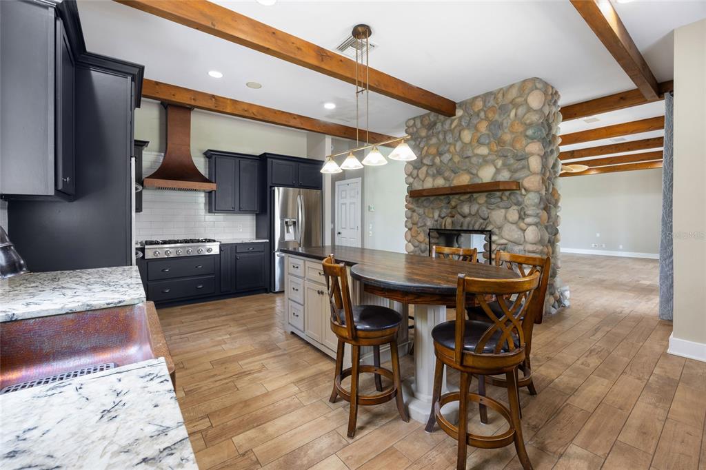 25 Southeast 69th Place Ocala, FL 34480 - Photo 10 of 52 a kitchen with a table and chairs in it