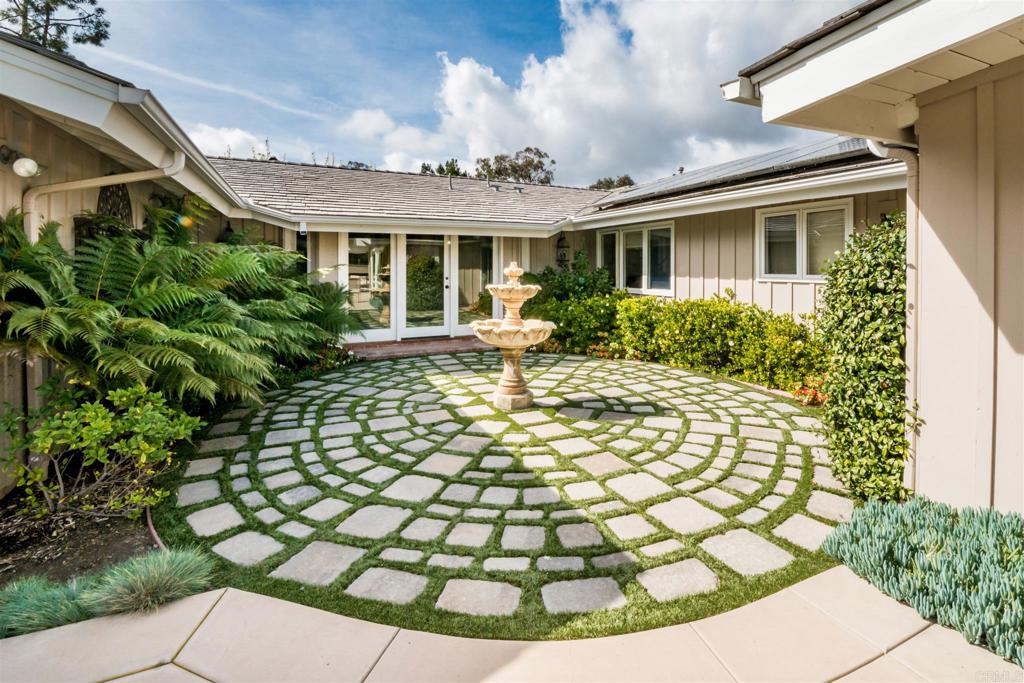 6571 Mimulus Rancho Santa Fe, CA 92067 - Photo 28 of 36 a view of a house with backyard and sitting area