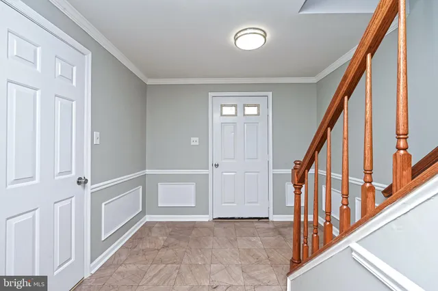a view of an entryway with wooden floor