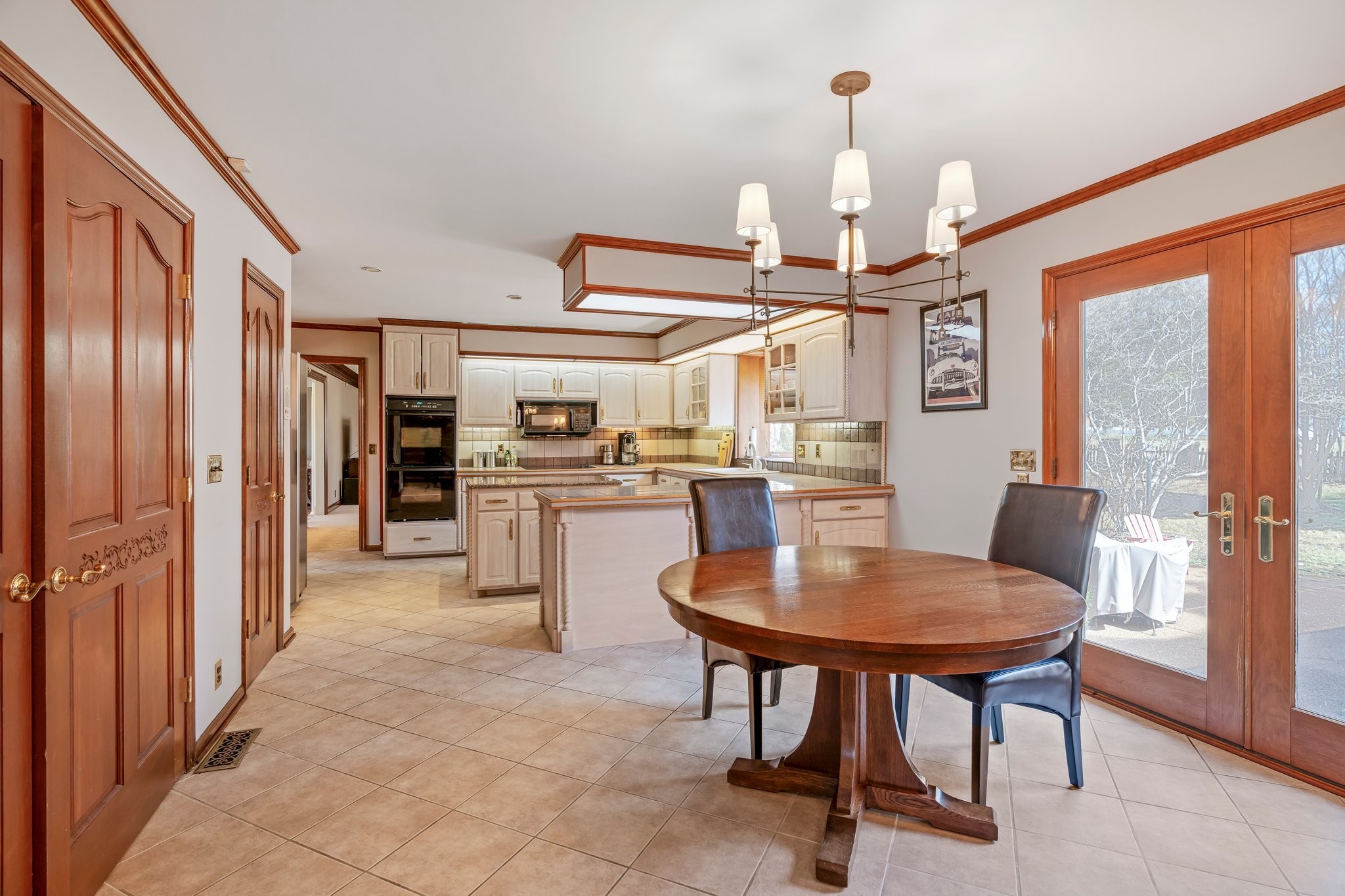 6375 Chickering Circle Nashville, TN 37215 - Photo 22 of 59 a open kitchen with stainless steel appliances granite countertop a refrigerator a stove and a dining table with wooden floor