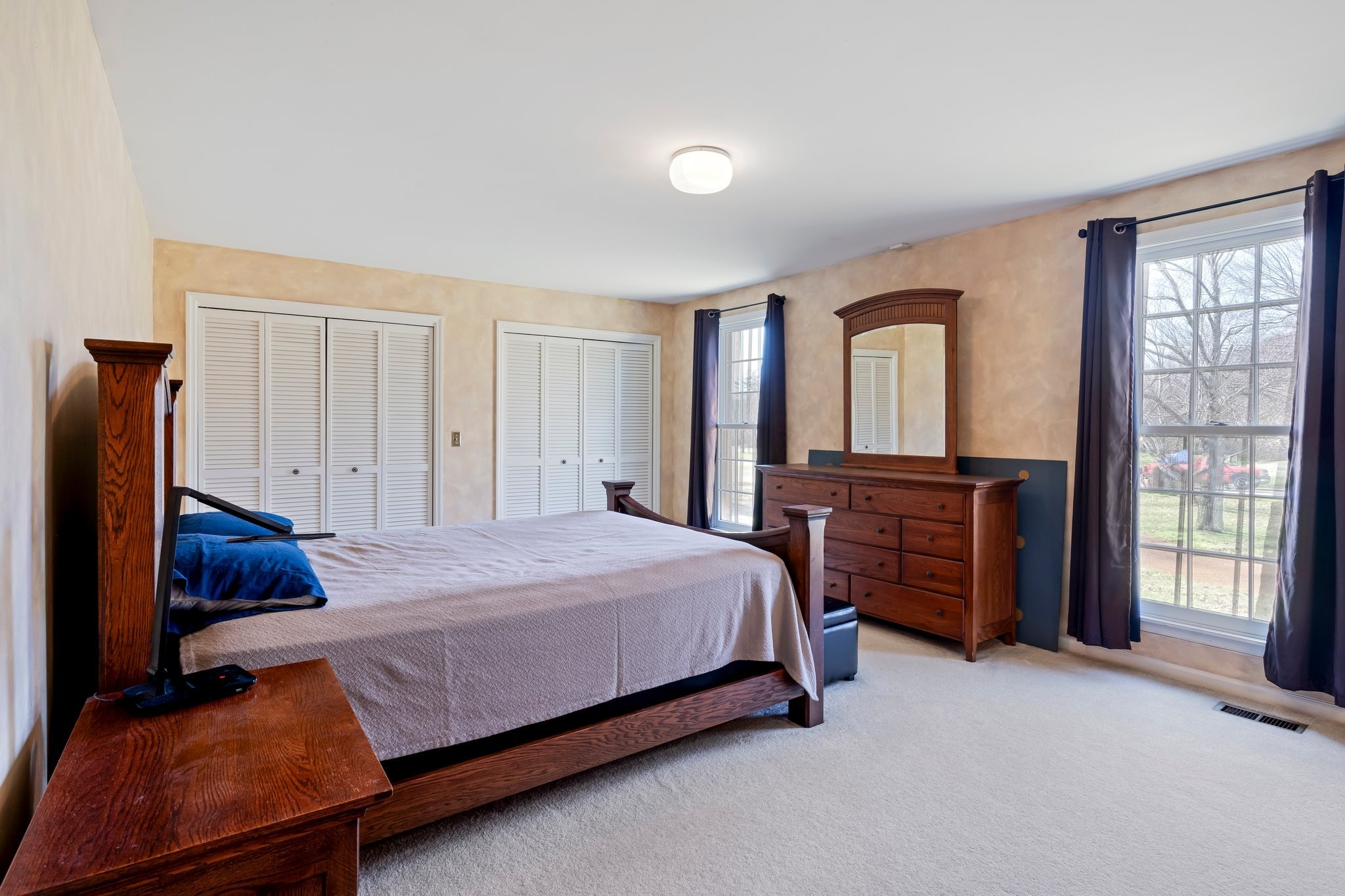 6375 Chickering Circle Nashville, TN 37215 - Photo 27 of 59 a bedroom with a bed and a dresser with mirror