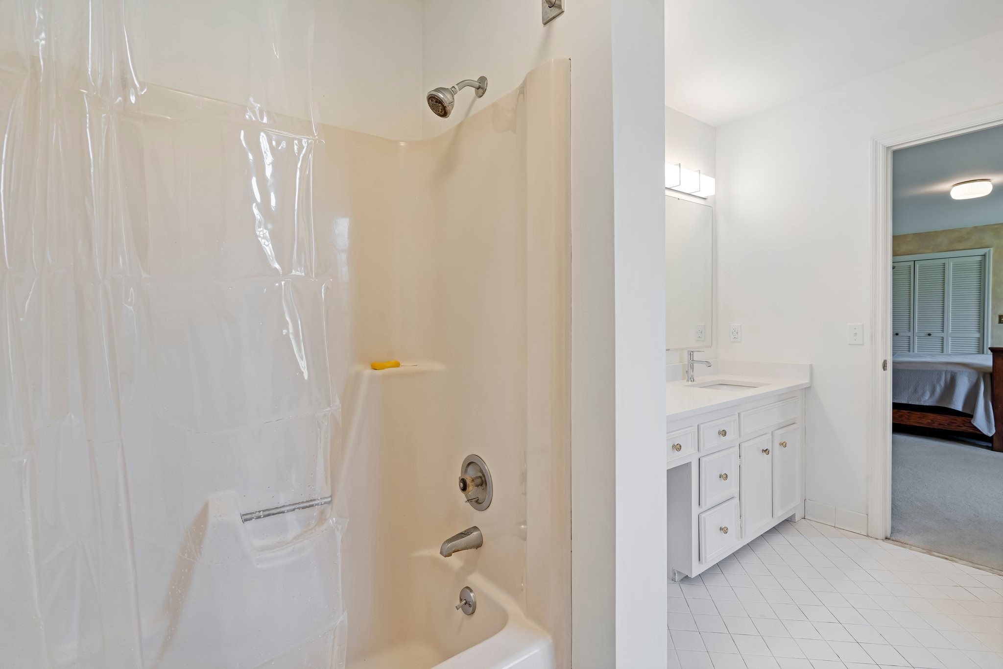 6375 Chickering Circle Nashville, TN 37215 - Photo 30 of 59 a bathroom with a double vanity sink a mirror a bathtub and shower