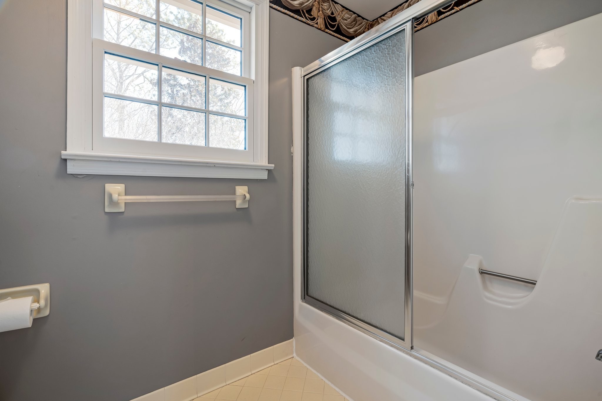 6375 Chickering Circle Nashville, TN 37215 - Photo 48 of 59 a bathroom with a shower and a window