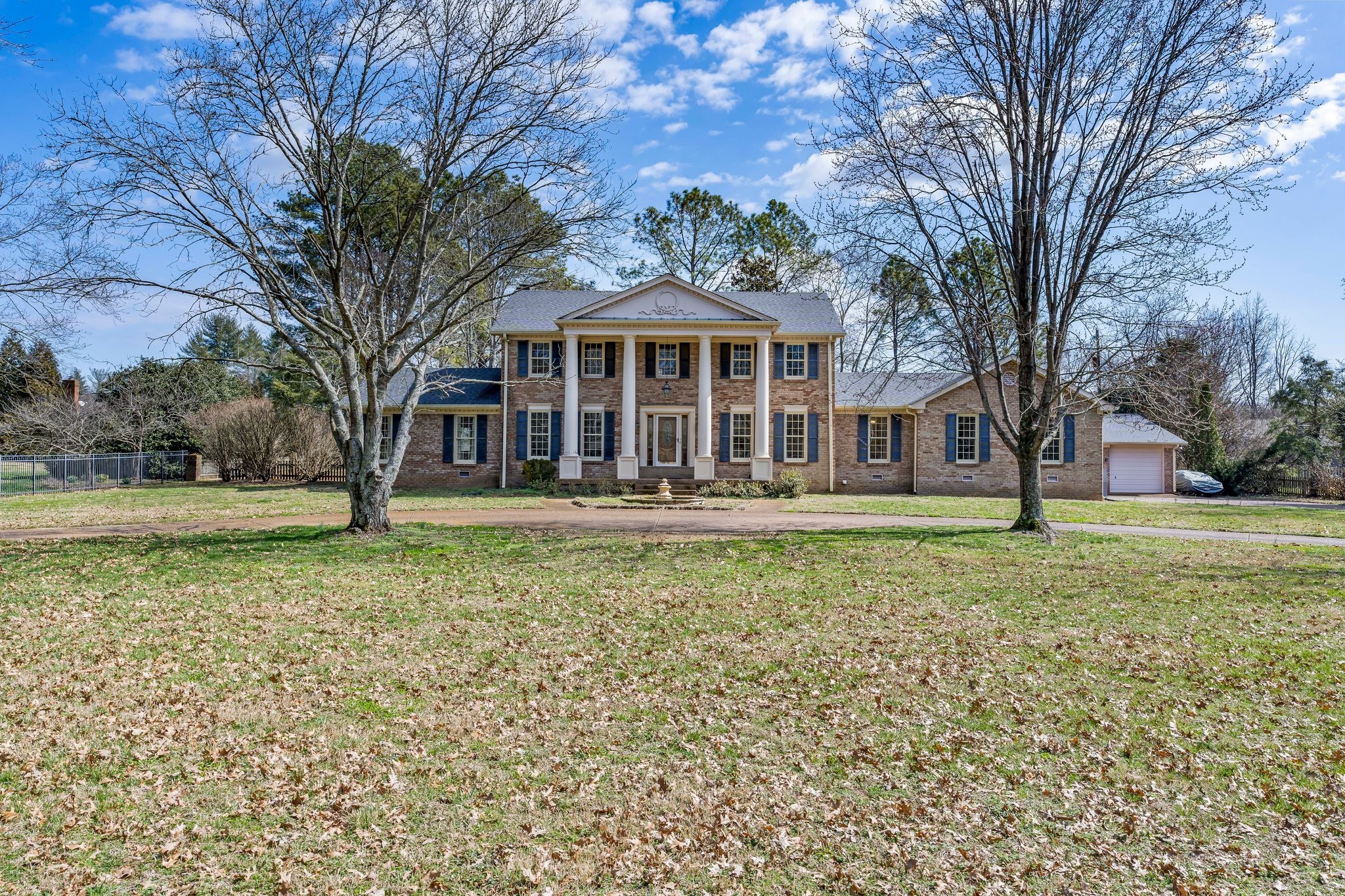 6375 Chickering Circle Nashville, TN 37215 - Photo 5 of 59 a front view of a house with a garden