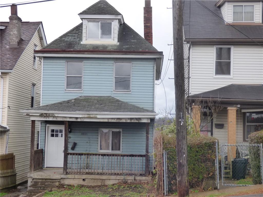 1021 Rue Grande Vue Street Pittsburgh, PA 15220 - Photo 1 of 22 a front view of a house with garden