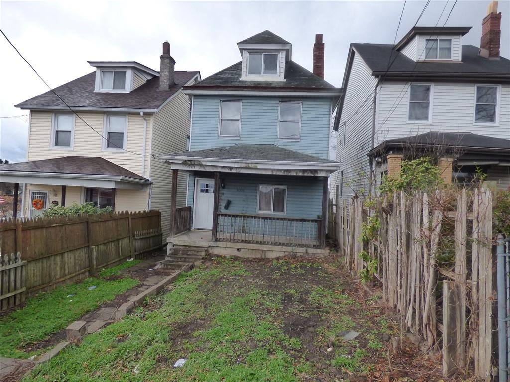 1021 Rue Grande Vue Street Pittsburgh, PA 15220 - Photo 3 of 22 a front view of a house with a yard