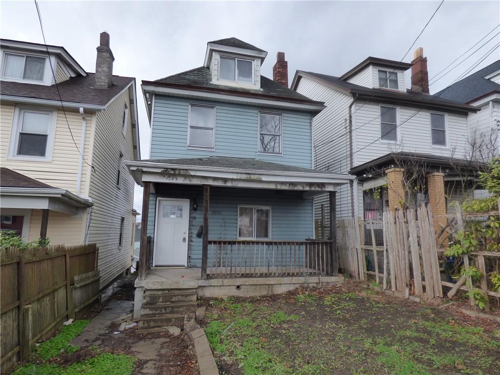 1021 Rue Grande Vue Street Pittsburgh, PA 15220 - Photo 4 of 22 a front view of a house with a garden