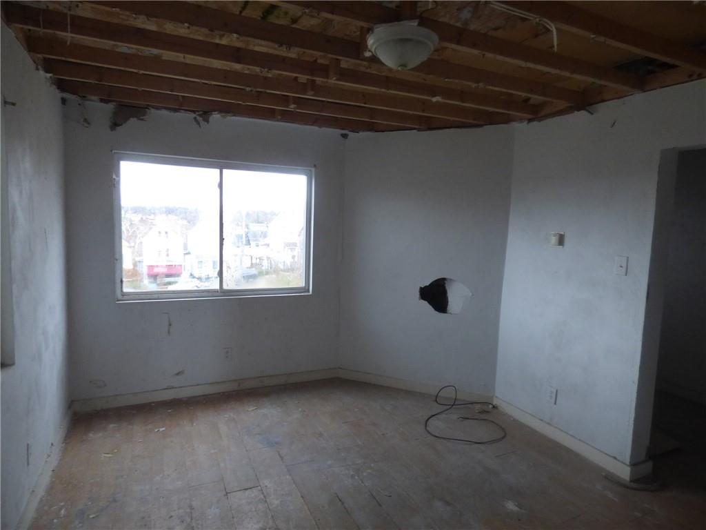 1021 Rue Grande Vue Street Pittsburgh, PA 15220 - Photo 8 of 22 a view of an empty room with a window