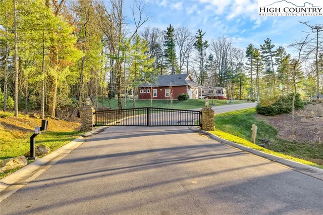 a view of backyard with swimming pool and outdoor seating