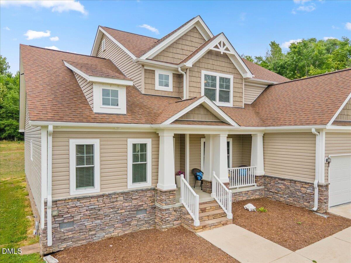 704 Haw River Hopedale Road Burlington, NC 27217 - Photo 4 of 49 a front view of a house with a yard and porch