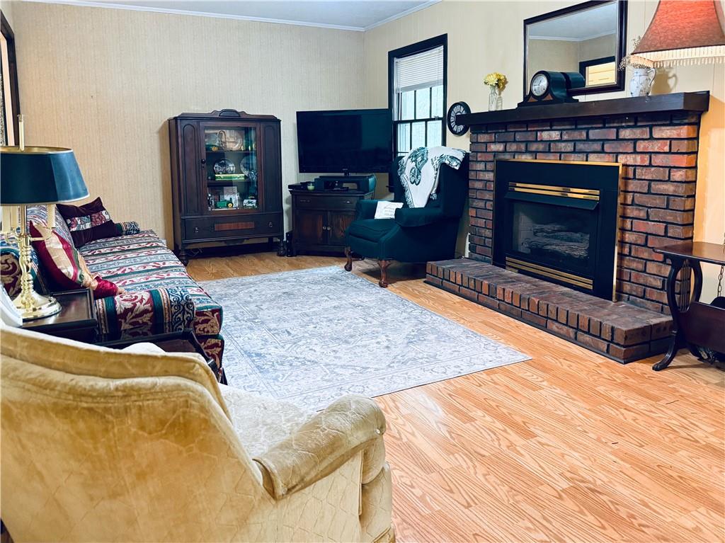 217 Cherokee Circle Cedartown, GA 30125 - Photo 13 of 25 a living room with furniture and a fireplace