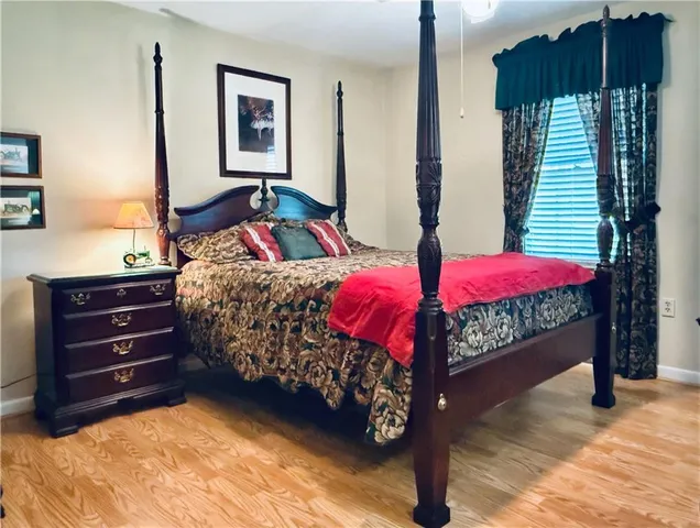 a bedroom with a bed and window