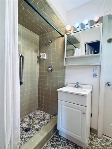 a bathroom with a sink toilet and shower