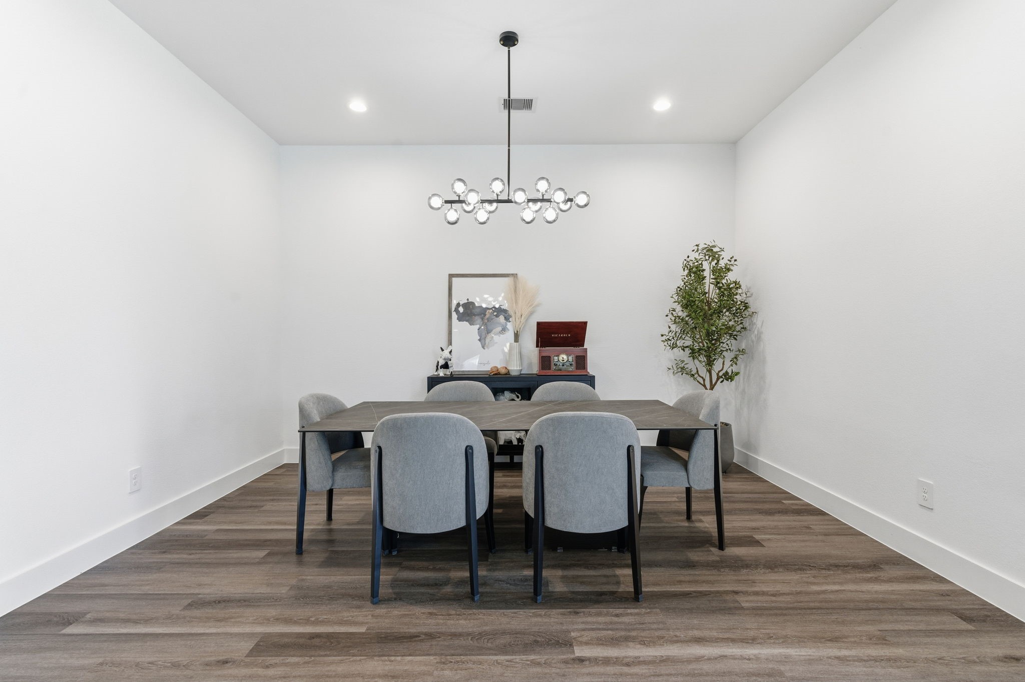 13776 Rising Sun Lane Conroe, TX 77384 - Photo 11 of 30 a view of a dining room with furniture wooden floor and chandelier