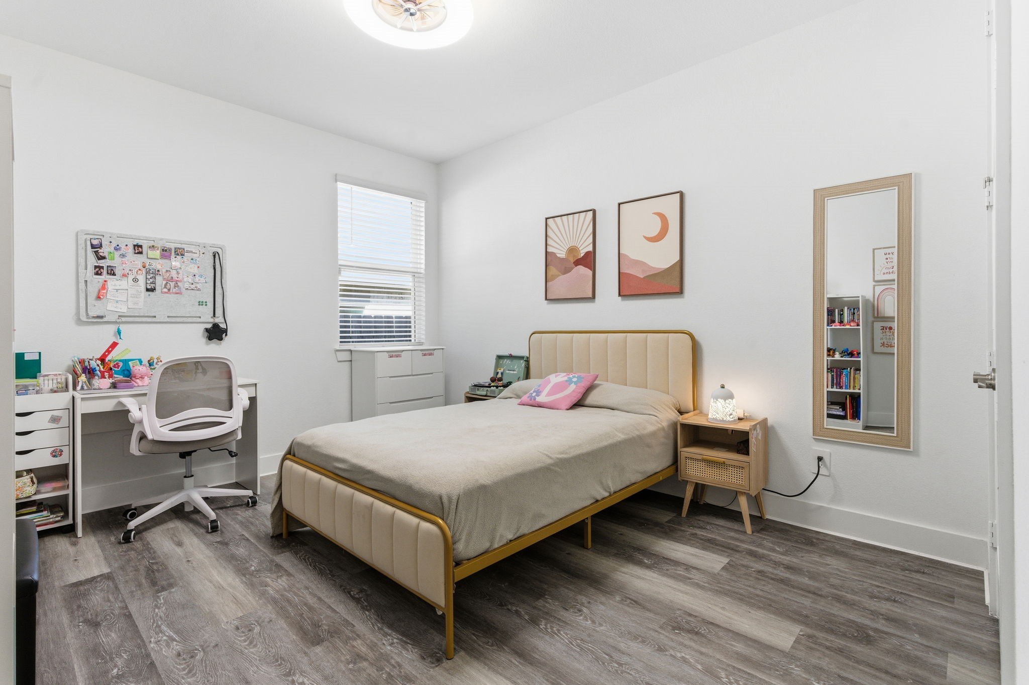 13776 Rising Sun Lane Conroe, TX 77384 - Photo 21 of 30 a bedroom with a bed and a table in it