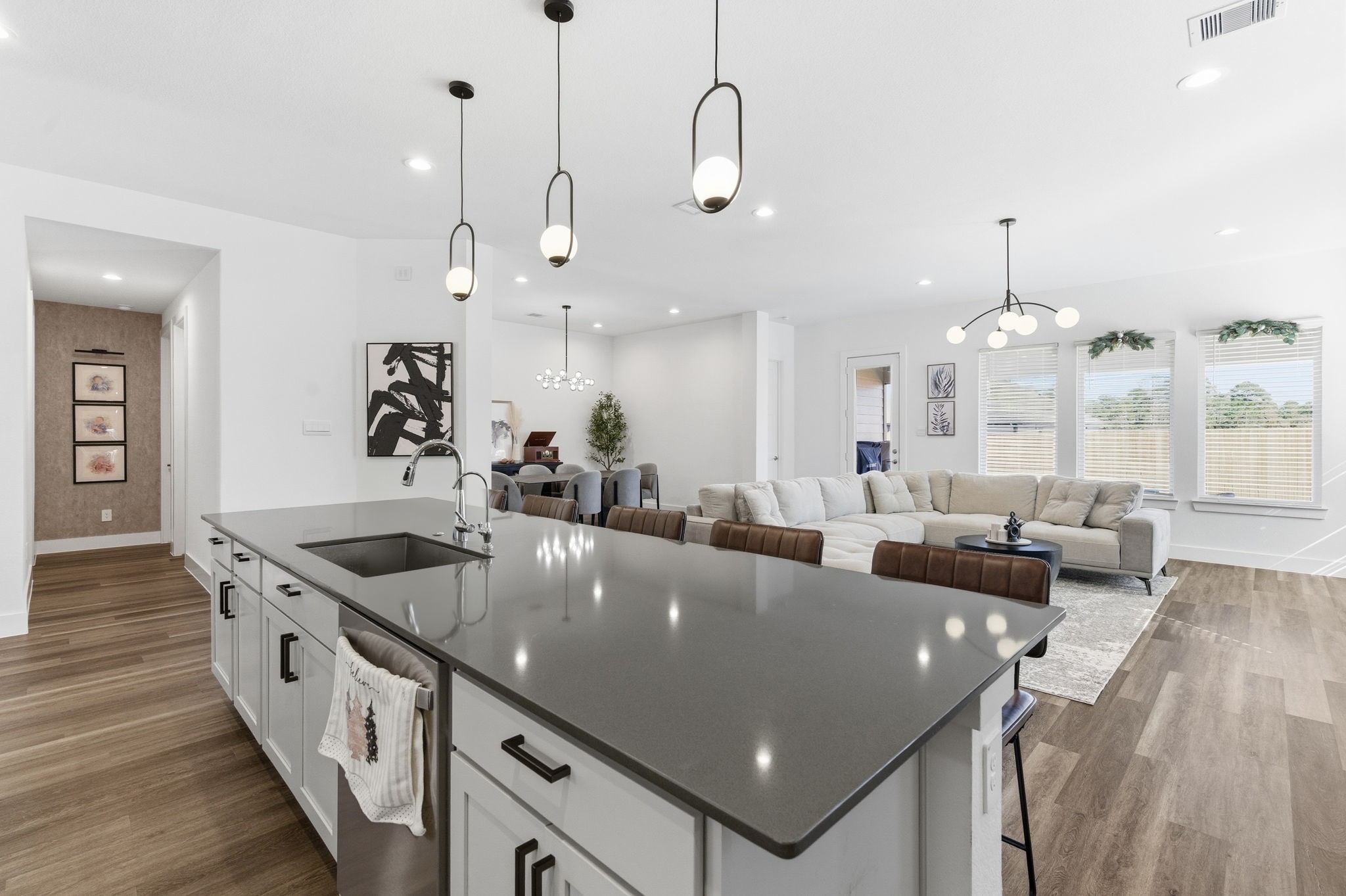 13776 Rising Sun Lane Conroe, TX 77384 - Photo 5 of 30 an open kitchen with stainless steel appliances granite countertop a sink a counter top space and living room view