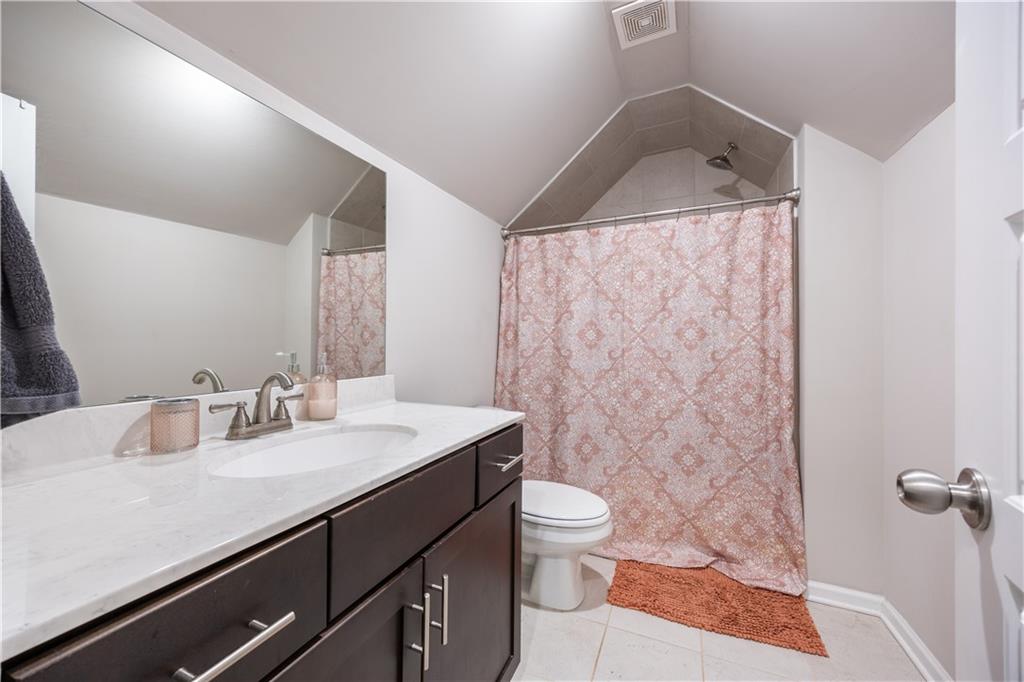 184 Ashford Lane Commerce, GA 30529 - Photo 23 of 49 a bathroom with a sink toilet and shower