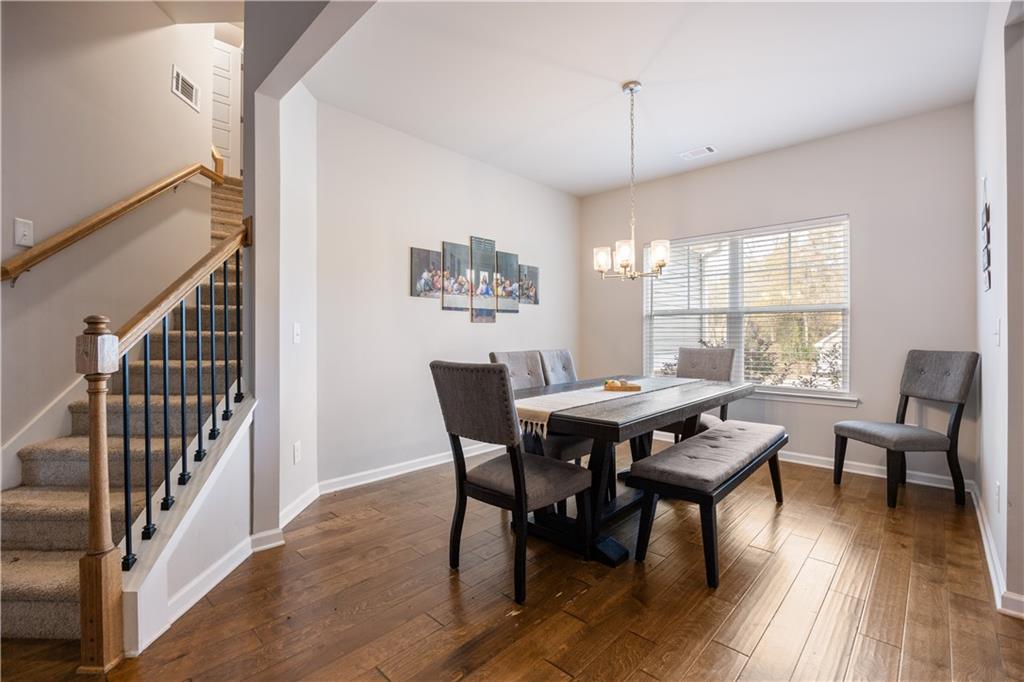 184 Ashford Lane Commerce, GA 30529 - Photo 25 of 49 a view of a dining room with furniture window and wooden floor