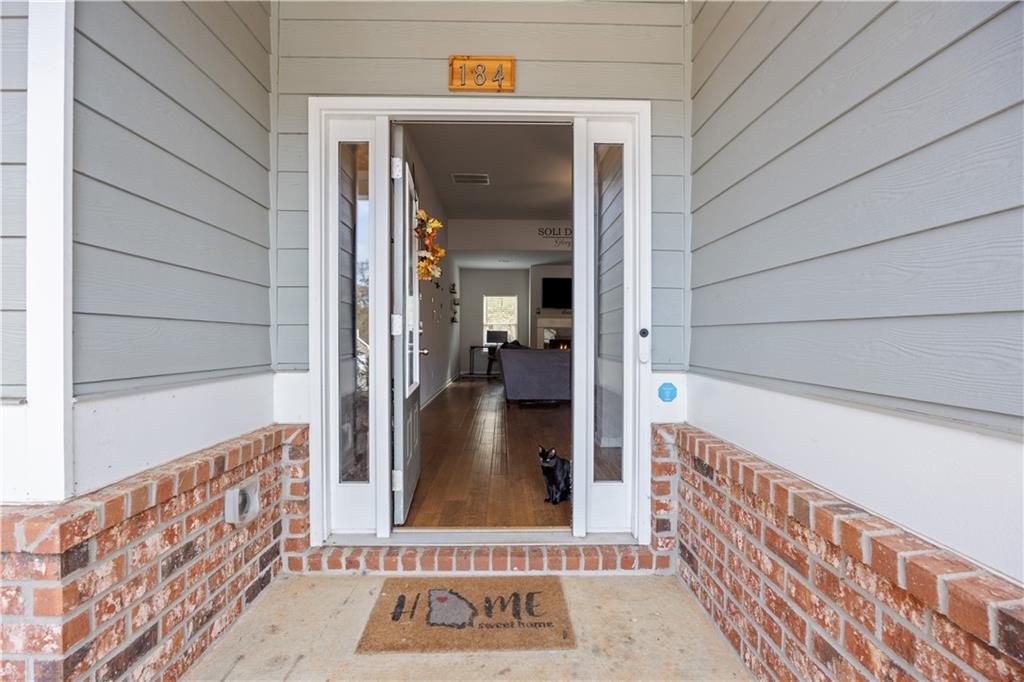 184 Ashford Lane Commerce, GA 30529 - Photo 27 of 49 a view of a hallway with wooden floor and a door