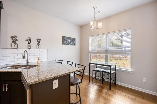 a view of a dining room with furniture window and outside view