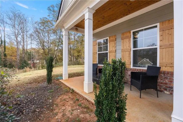a view of a chairs and table in the patio
