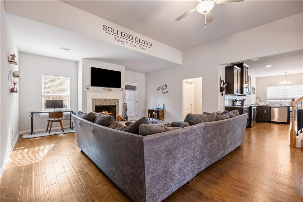 184 Ashford Lane Commerce, GA 30529 - Photo 4 of 49 a living room with fireplace furniture and a flat screen tv