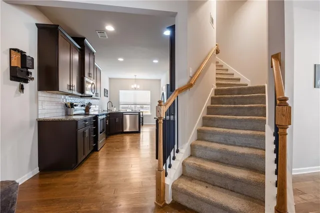 a view of kitchen with cabinets and flat screen tv