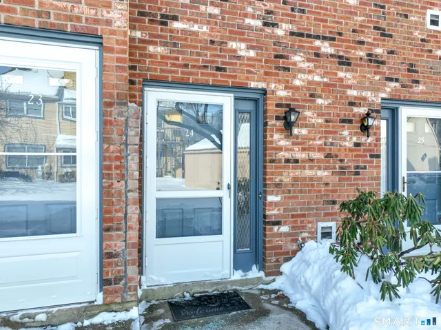 a front view of a house with a glass door