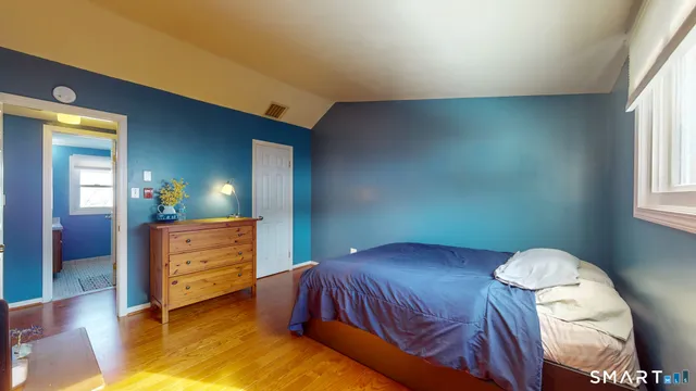 a bedroom with a bed and lamps